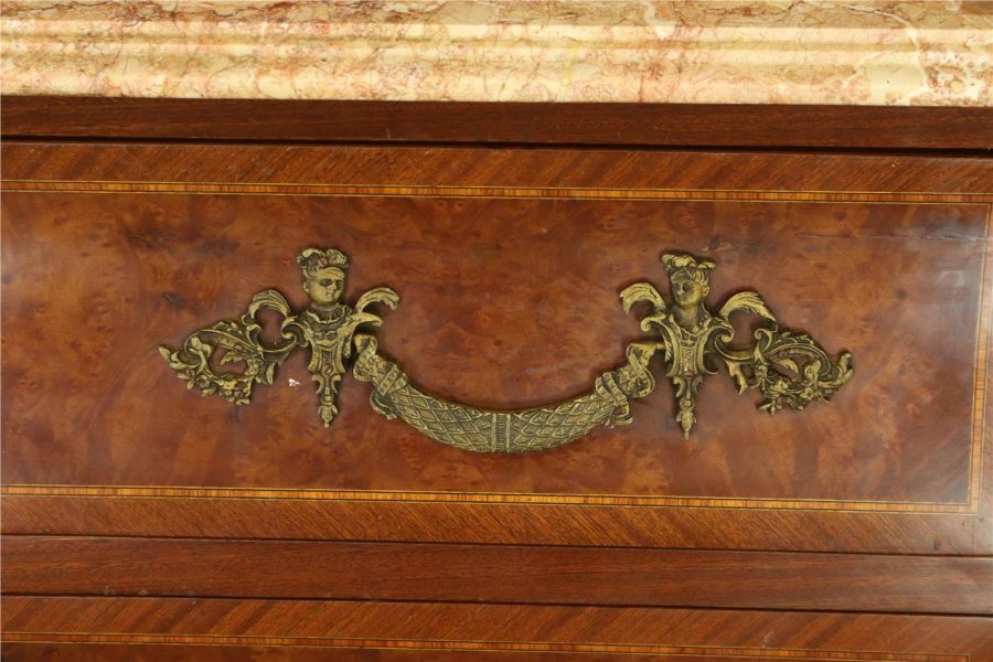 a handle on a rococo chest of drawers
