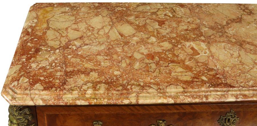 the marble top of a chest of drawers