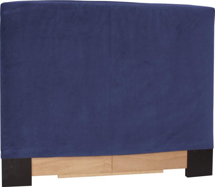 A blue headboard upholstered with soft cloth.